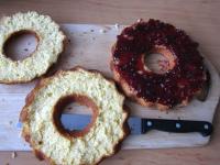 Cut the bundt cake into three layers. Spread jam...