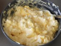 Mix cream curd, crushed cheese and egg yolks in a...