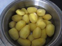 Peel the potatoes and cook in salty water....