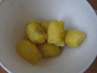 Cook half of the prepared potatoes in their skins,...