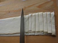 Place floured strips on top of each other and use...