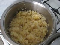 Squeeze out the sauerkraut and add into the onion...