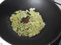 Cook in a little oil peeled and chopped onion with...