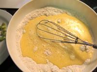 Mix eggs with milk and oil. Mix both mixtures and...