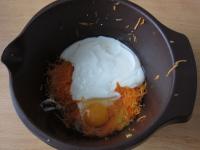 Pour yogurt, oil and egg into the carrot base....