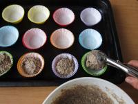 Put paper cups in the muffin moulds and pour the...