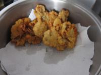 Place fried oyster mushrooms into dish with paper...