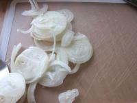 Peel onion and cut it into thin slices ......