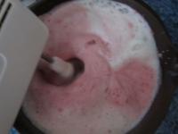 Pour mixed strawberries to egg whites foam and...