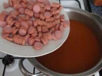 Cut pork sausages into the thin circles, add them...