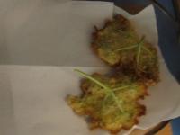 Put the fried flowers on a paper napkin to absorb...