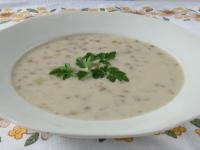 Serve soup decorated with fresh parsley leaves. It...