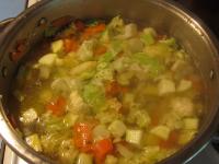 Pour in hot water and cook vegetables until soft...