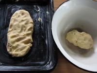 Grease the baking tray with butter and place two...