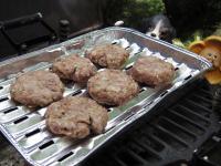 Roast the hamburgers in hot grill from one side...