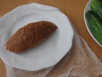 Wrap a piece of bread (end piece) in a clean wet...