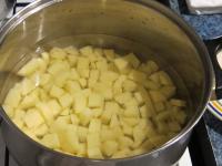 Peel potatoes and cut them into small cubes. Cook...