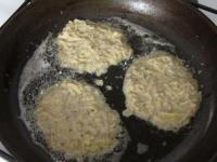 Fry pancakes from the dough in oil, from both...