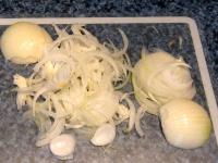 Peel an onion, cut into rings and then in half,...