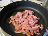 Cut pork into strips and saute it in oil in the...