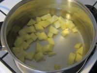 Peel the potatoes, cut into small cubes and cook...