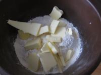 Measure flour into a bowl, add sugar, sliced...