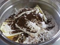 Pour flour, sugar, coffee and ground almonds into...