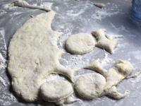 Use a rolling pin to spread the yeast-raised dough...