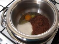 Beat eggs, sugar and cocoa powder over a steam....