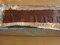 Take aluminium foil with the dough out of the...