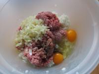 In deep bowl put mince meat, add eggs, fried...