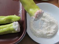 Tops of peppers soak in flour and place into the...