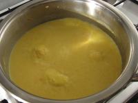 Immediately pour the mixture into the soup in the...