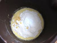 Stir in flour with baking tin ......