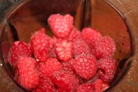 Rinse fresh raspberries and pour them into the...