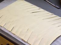 Use a rolling pin to spread the puff pastry and...