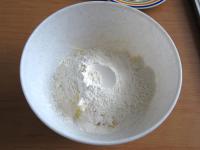 Mix in flour with baking powder. Work the stiff...