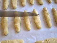 Place the fingers on baking tin lined with...