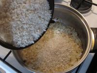 Rinse the rice and add it to onion. Season with...