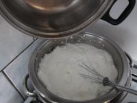 Transfer egg whites into a pot placed in another,...