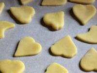 Place hearts on the tray covered with baking...