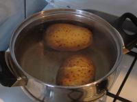 Wash half part of potatoes, cook them unpeeled and...