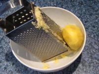 Peel the other half of potatoes, wash and grate....