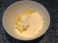 Add flour into the grated potatoes, mix well......