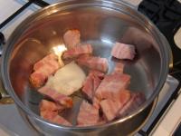 Cut meaty english bacon and fry in a little lard....