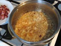 Peel the onion and cut. Remove fried bacon from...