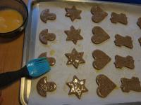 Put the shapes on a baking sheet lined with baking...