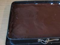 Spread chocolate topping on top of the stiff...