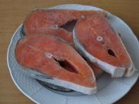 Defrost frozen salmon steaks, wash them and dry. ...