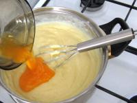 Stir egg yolks in and bring to the boil. Transfer...